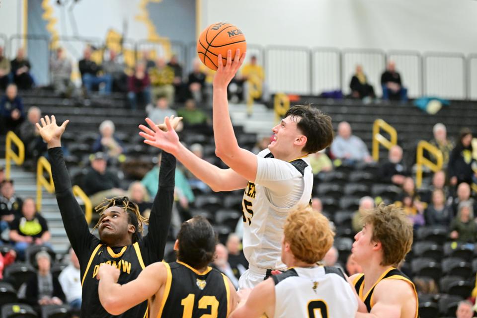 Wooster's Nick Everett scored a career-high 26 points on 11-of-11 shooting in a NCAC Tournament win over DePauw.