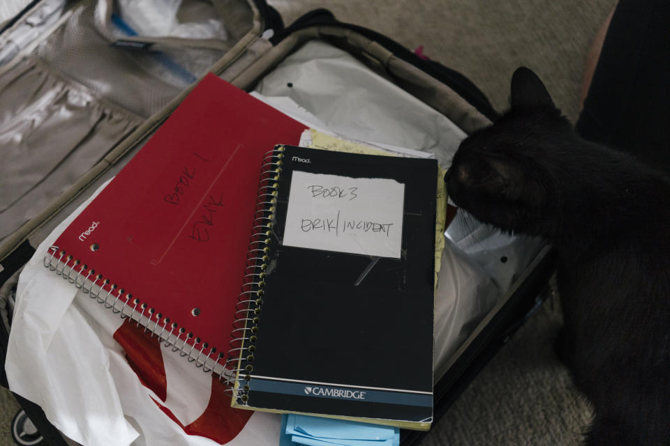 A suitcase is filled with documents and notes about Leah&nbsp;Olszewski's ex-boyfriend Erik Cardin.&nbsp; (Photo: Lexey Swall for HuffPost)