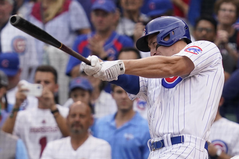 Chicago Cubs' Frank Schwindel hits the game-wining single during the ninth inning of a baseball game against the Pittsburgh Pirates in Chicago, Saturday, Sept. 4, 2021. The Cubs won 7-6. (AP Photo/Nam Y. Huh)