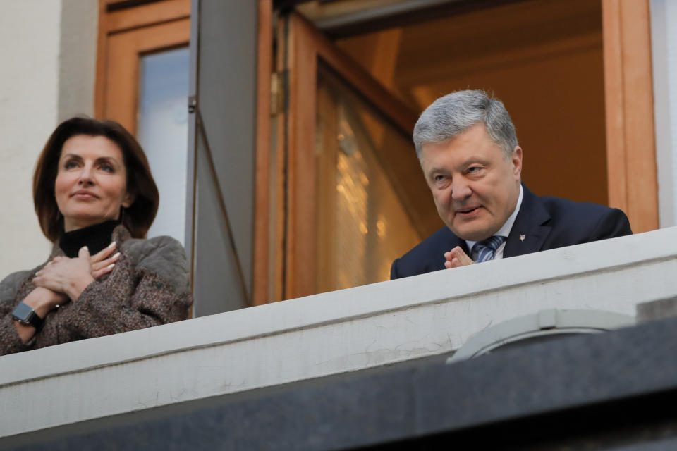 Ukrainian President Petro Poroshenko and his wife Maryna greet their supporters who have come to thank him for what he did as a president, in Kiev, Ukraine, Monday, April 22, 2019. Political mandates don't get much more powerful than the one Ukrainian voters gave comedian Volodymyr Zelenskiy, who as president-elect faces daunting challenges along with an overwhelming directive to produce change. (AP Photo/Vadim Ghirda)