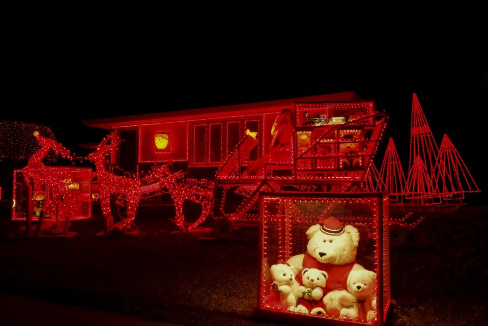 A red light-up Santa sleigh sits at 600 South Edward Drive.