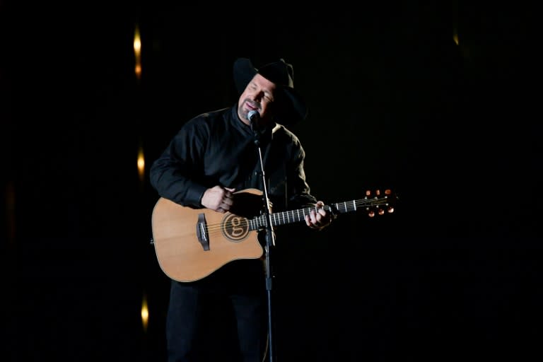 Singer-songwriter Garth Brooks performs onstage during the 52nd annual CMA Awards, where he paid tribute to those shot at a country music bar in California