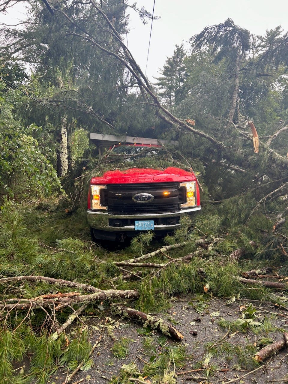 A tree fell on this Mattapoisett Highway Department vehicle near the intersection of Acushnet and Hereford Hill roads as a tornado moved through the north side of town in August.