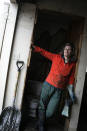 <p>Debbie Mones takes a break from shoveling mud and oil out of the backyard shed of her home, which was severely damaged by flooding during Hurricane Katrina, in Chalmette, La., east of New Orleans, Dec. 17, 2005. (Photo: Jacqueline Larma/AP) </p>