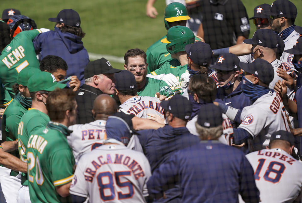 A brawl broke out between the A's and Astros Sunday after Ramon Laureano charged Alex Cintrón in the Astros dugout. (Photo by Thearon W. Henderson/Getty Images)