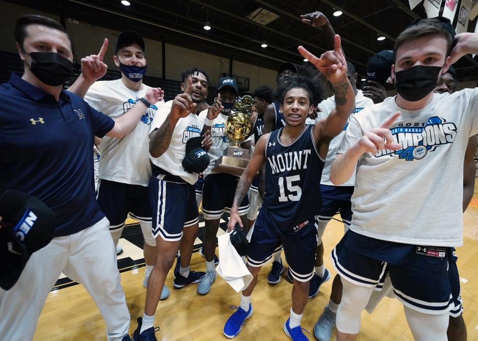 Mount St. Mary’s point guard Damian Chong Qui celebrates with his teammates after the win. (Credit: David Silverman Photography/DSPics.com)