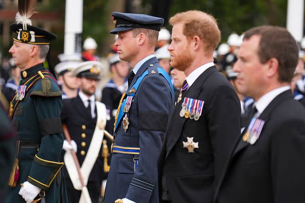 LONDON, ENGLAND - SEPTEMBER 19: Prince William, Prince of Wales and Prince Harry, Duke of Sussex follow a gun carriage carrying the coffin of Queen Elizabeth II during the State Funeral of Queen Elizabeth II at Westminster Abbey on September 19, 2022 in London, England. Elizabeth Alexandra Mary Windsor was born in Bruton Street, Mayfair, London on 21 April 1926. She married Prince Philip in 1947 and ascended the throne of the United Kingdom and Commonwealth on 6 February 1952 after the death of her Father, King George VI. Queen Elizabeth II died at Balmoral Castle in Scotland on September 8, 2022, and is succeeded by her eldest son, King Charles III. (Photo by Emilio Morenatti - WPA Pool/Getty Images)