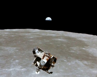 FILE PHOTO: The Apollo 11 Lunar Module ascent stage, with astronauts Neil A. Armstrong and Edwin E. Aldrin Jr. aboard, is photographed from the Command and Service Modules in lunar orbit in this July 1969 file photo.   Courtesy NASA/Handout via REUTERS