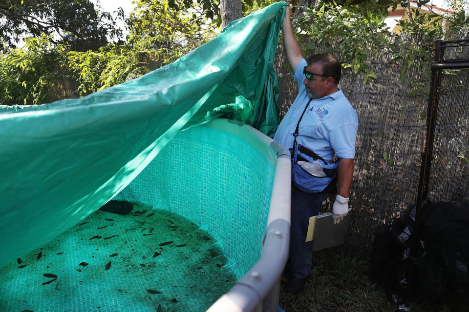 <p>Robert Muxo, a Miami-Dade County mosquito control inspector, inspects a property for mosquitos or breeding areas in the Wynwood neighborhood as the county fights to control the Zika virus outbreak on July 30, 2016 in Miami, Fla. (Joe Raedle/Getty Images)</p>