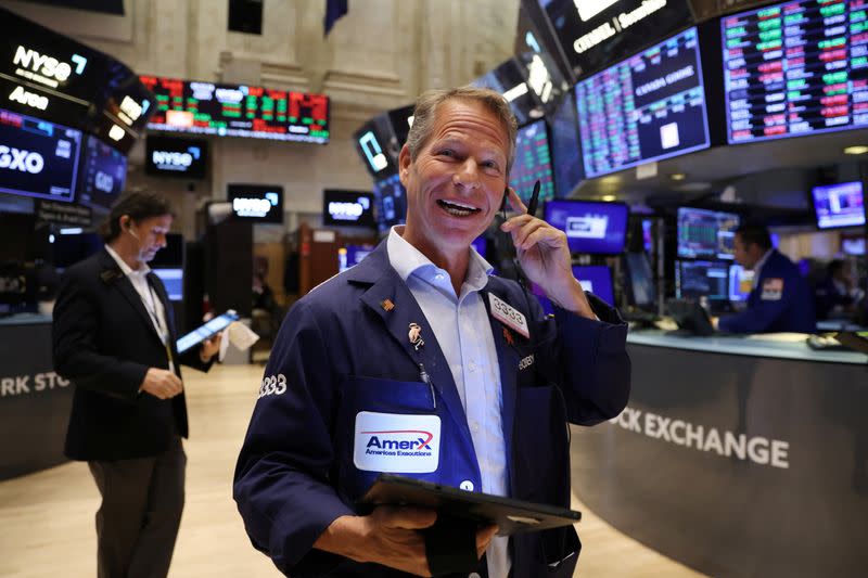 Traders work on the trading floor at the New York Stock Exchange (NYSE) in Manhattan, New York City