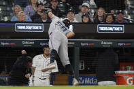 Miami Marlins third baseman Tristan Gray (59) reaches into the dugout to catch the foul ball hit by Detroit Tigers' Spencer Torkelson during the tenth inning of a baseball game, Tuesday, May 14, 2024, in Detroit. (AP Photo/Carlos Osorio)