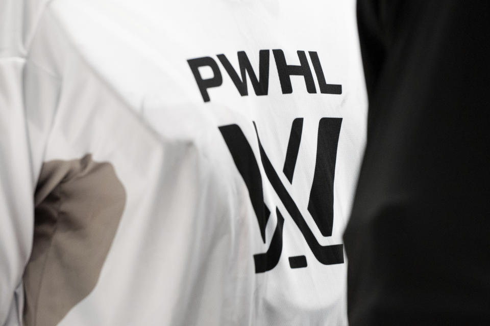 FILE - A PWHL logo is seen on a player's jersey during Professional Women's Hockey League (PWHL) training camp at TD Place in Ottawa, Ontario, Friday, Nov. 17, 2023. The long-envisioned dream of having one North American women's hockey league bringing together the world's top players is finally approaching reality. The Professional Women's Hockey League will kick off the new year and its inaugural season on Monday, Jan. 1, 2024 when the yet-to-be named Toronto franchise hosts New York. (Graham Hughes/The Canadian Press via AP)