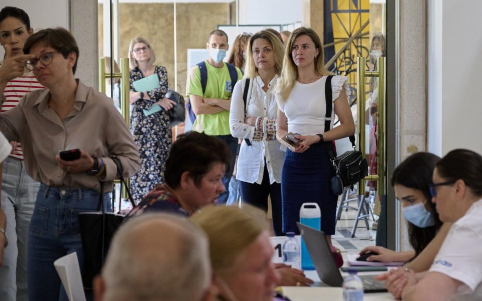 Ukrainian refugees wait in line to be interviewed by SONAE during Recruitment Day, in partnership with the Lisbon City Hall (CML), to offer them different job opportunities on June 6, 2022, in Lisbon, Portugal. - Horacio Villalobos/Corbis News