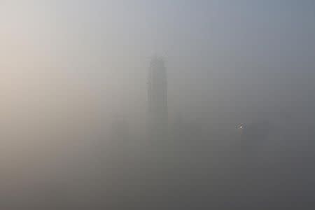 Landmark buildings are seen during a heavily polluted day in Beijing, China, January 1, 2017. REUTERS/Stringer