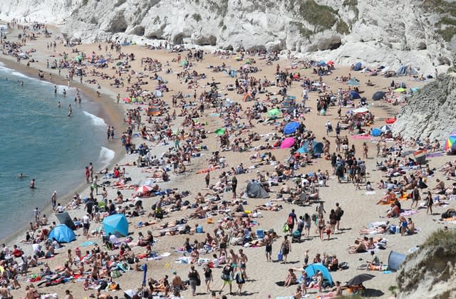 People on the beach at Durdle Door on Sunday (Andrew Matthews/PA)