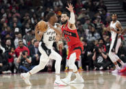 Toronto Raptors guard Fred VanVleet (23) defends against San Antonio Spurs guard Malaki Branham (22) during the first half of an NBA basketball game Wednesday, Feb. 8, 2023, in Toronto. (Arlyn McAdorey/The Canadian Press via AP)