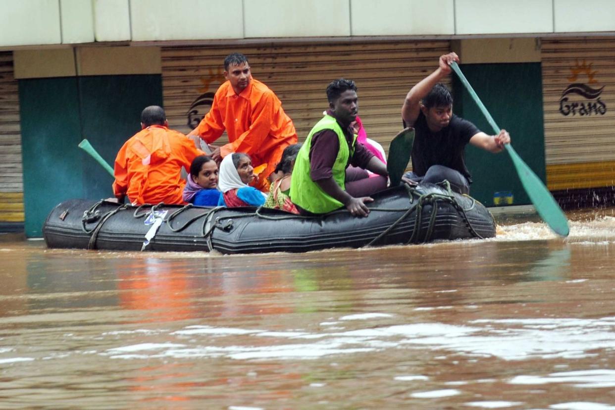 Indian navy officials evacuate survivors: AFP/Getty Images
