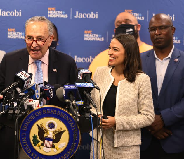 Senate Majority Leader Chuck Schumer (D-N.Y.) speaks alongside Reps. Alexandria Ocasio-Cortez and Jamaal Bowman (D-N.Y.) in June 2021. Justice Democrats recruited Ocasio-Cortez and Bowman and helped them oust moderate Democrats.