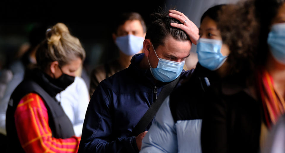 People lined up to be vaccinated at a mass coronavirus vaccination hub at the Melbourne Convention and Exhibition Centre on Friday. Source: AAP