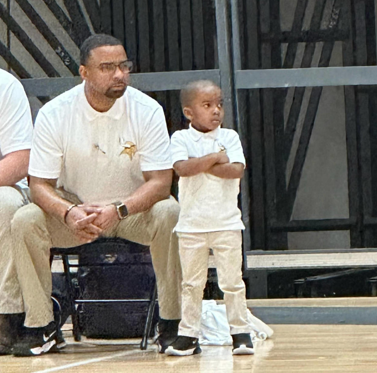 Coach Chris Bess and son at basketball game. (Courtesy Natalie Bess)