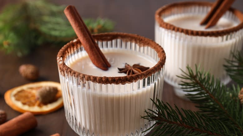 Glass of eggnog with cinnamon stick