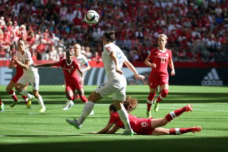 Jun 27, 2015; Vancouver, British Columbia, CAN; (Editors note: Caption correction) England defender Lucy Bronze (12) scores against Canada during the first half in the quarterfinals of the FIFA 2015 Women's World Cup at BC Place Stadium. Mandatory Credit: Matt Kryger-USA TODAY Sports