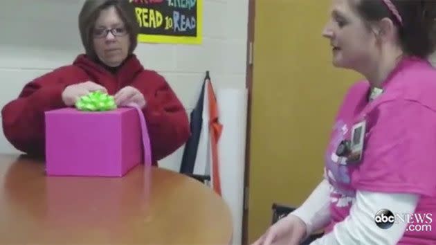 Natasha's grandmother, Chris Burelton, opens the box disguised to be a small gift for 'doing so much'. Photo: ABC News