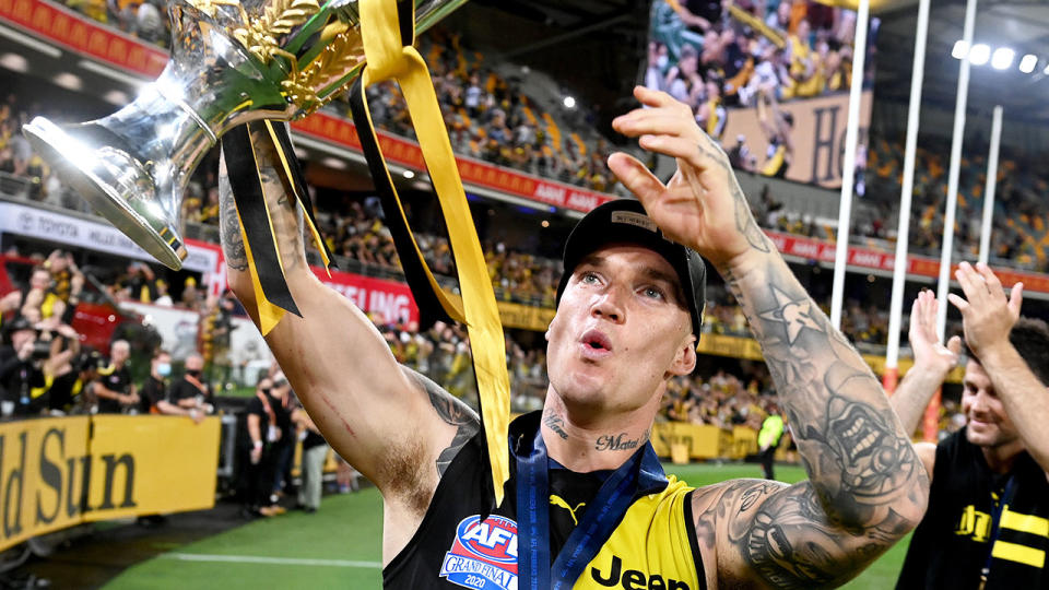 Seen here, Dustin Martin celebrates Richmond's 2020 AFL grand final win