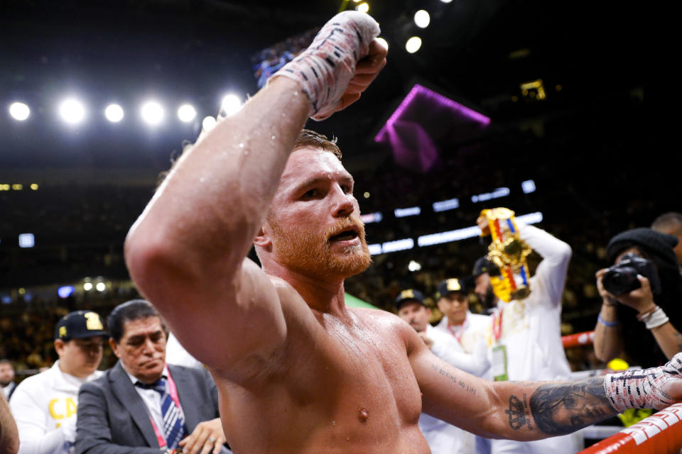 Canelo Alvarez, of Mexico, celebrates his win over Daniel Jacobs in a middleweight title boxing match Saturday, May 4, 2019, in Las Vegas. (AP Photo/John Locher)