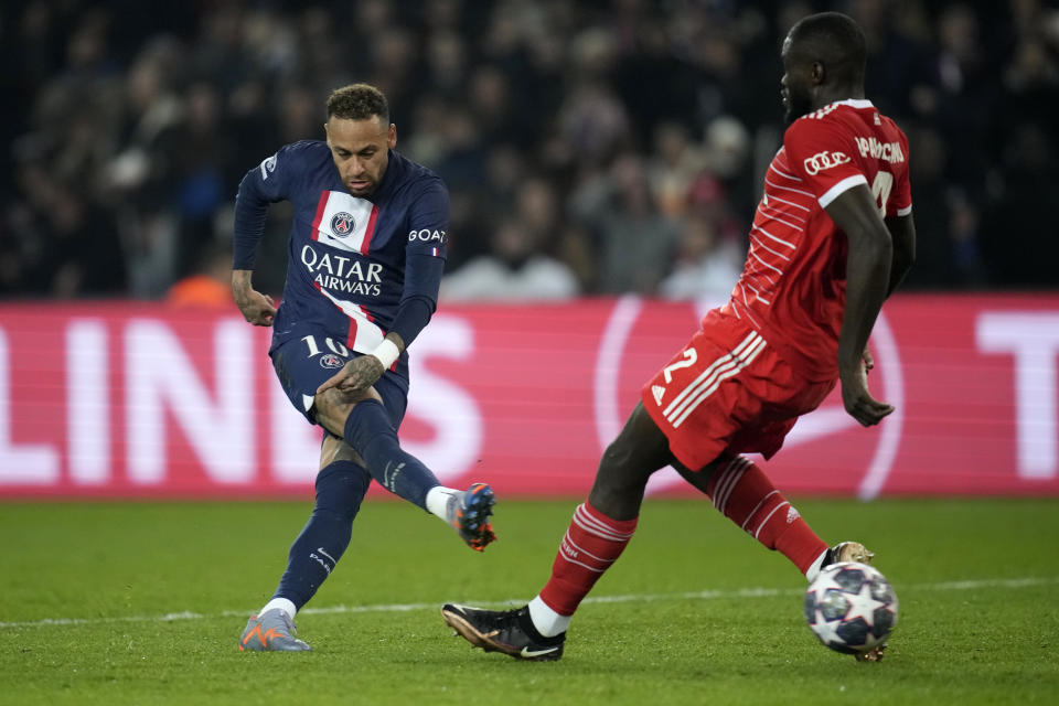 FILE - Bayern's Dayot Upamecano, right, tries to block a shot from PSG's Neymar during the Champions League round of 16 first leg soccer match between Paris Saint Germain and Bayern Munich, at the Parc des Princes stadium, in Paris, France, Tuesday, Feb. 14, 2023. (AP Photo/Christophe Ena, File)