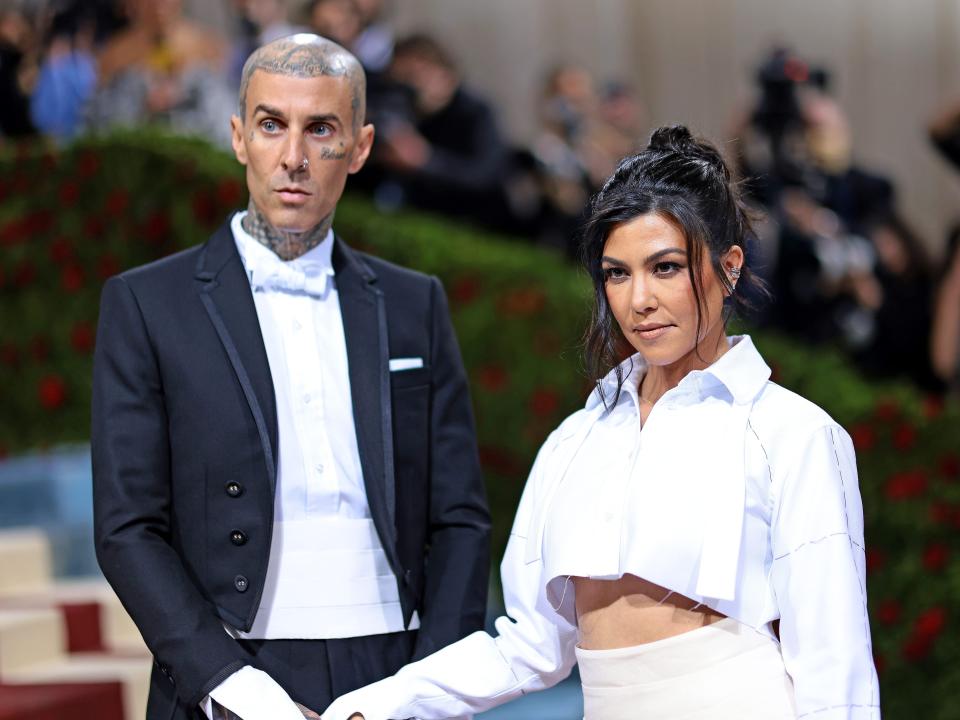 Kourtney Kardashian and Travis Barker attend the 2022 Met Gala.