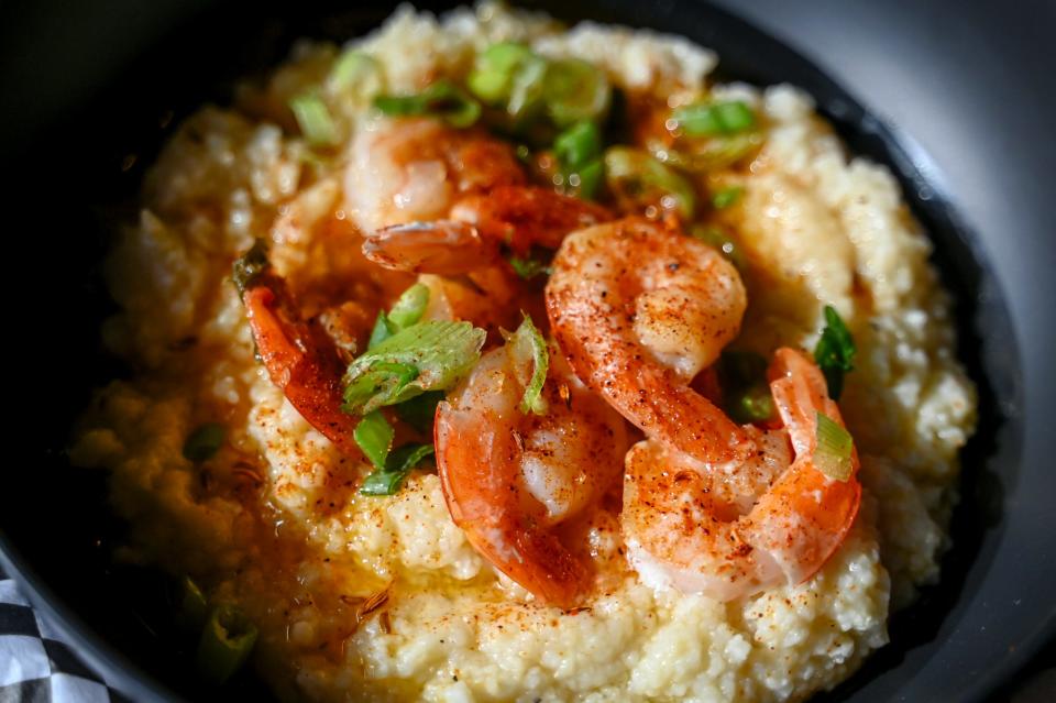 A dish featuring shrimp and grits sold at The Goat Marketplace and Bistro on Wednesday, Nov. 22, 2023, in Lansing.