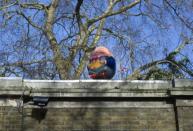 A Humpty Dumpty egg sits on the wall of Clarence House in London March 8, 2012.