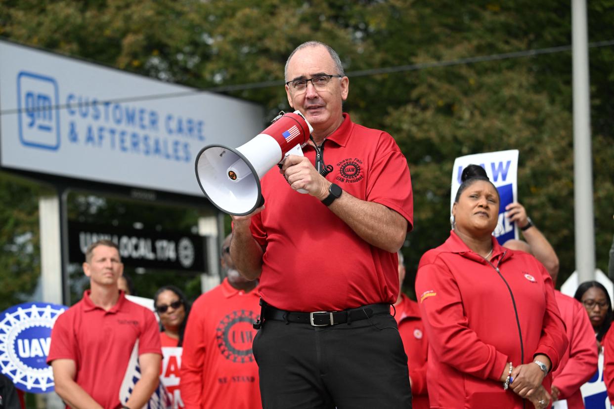 United Auto Workers (UAW) President, Shawn Fain addresses picketing UAW members at a General Motors Service Parts Operations plant in Belleville, Michigan, on September 26, 2023, as US President Joe Biden joined the workers. Some 5,600 members of the UAW walked out of 38 US parts and distribution centers at General Motors and Stellantis at noon September 22, 2023, adding to last week's dramatic worker walkout. According to the White House, Biden is the first sitting president to join a picket line. (Photo by Jim WATSON / AFP) (Photo by JIM WATSON/AFP via Getty Images)