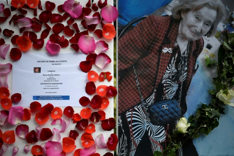 A picture of Mireille Knoll and a message announcing a silent march in her memory outside her apartment building in Paris on Tuesday