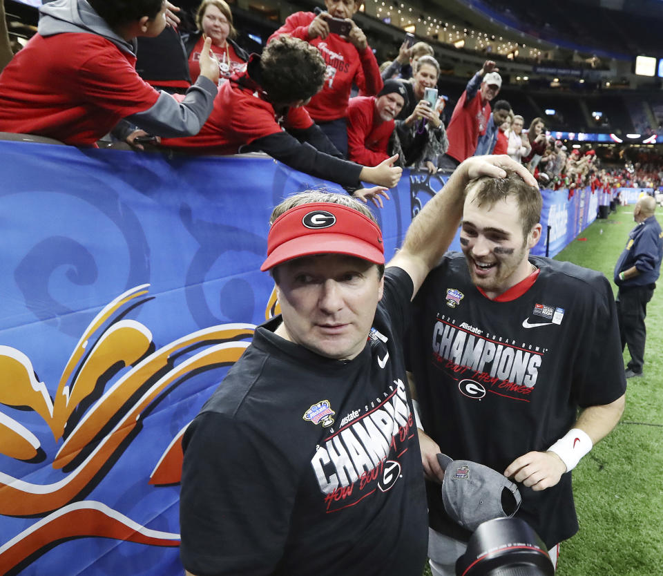 Georgia head coach Kriby Smart and quarterback Jake Fromm celebrate the team's 26-14 victory over Baylor in the Sugar Bowl NCAA college football game Wednesday, Jan. 1, 2020, in New Orleans. (Curtis Compton/Atlanta Journal-Constitution via AP)