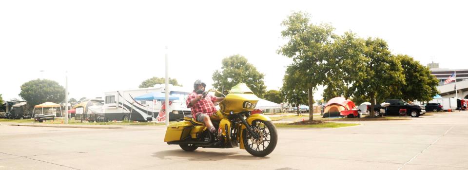 The 46th annual National Bikers Roundup is underway at Liberty Park in Memphis. The event, which runs Aug. 1-6, 2023, is expected to bring tens of thousands of people (and motorcycles) to Memphis. The event is being hosted locally by the Memphis Tennessee Roundup Committee. Motorcyclists cruise down a road at Liberty Park on August 2, 2023.