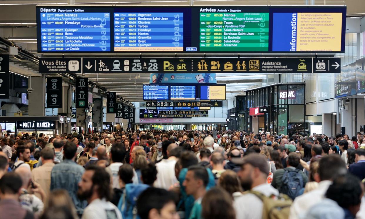 <span>Passengers faced disruption at Gare Montparnasse train station in Paris on Friday.</span><span>Photograph: Thibaud Moritz/AFP/Getty Images</span>