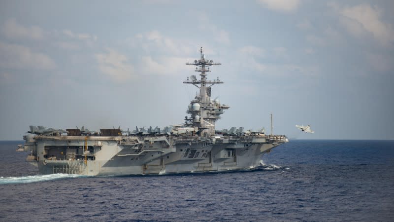 An F/A-18F Super Hornet launches from the flight deck of the U.S. Navy aircraft carrier USS Theodore Roosevelt in the Philippine Sea