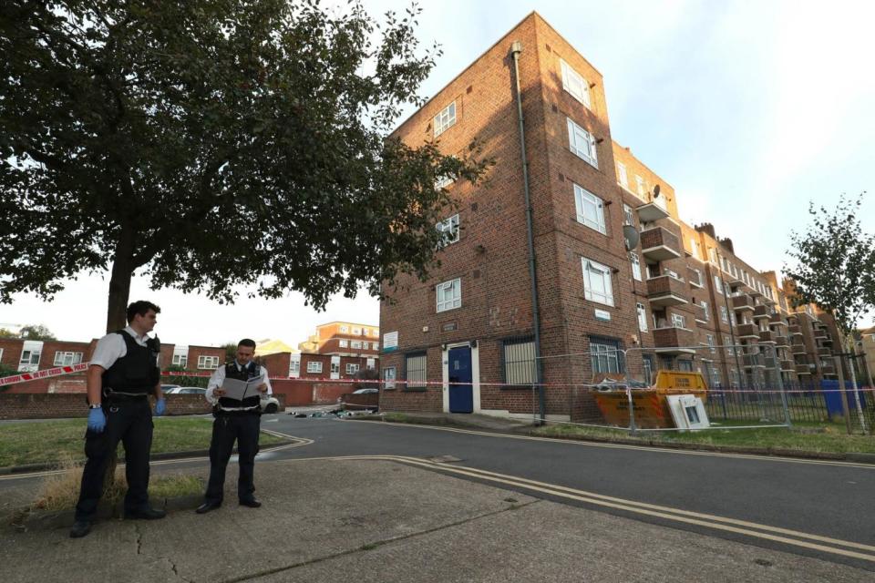 Crime scene: Police tape off the street outside Landor House in Camberwell (PA)