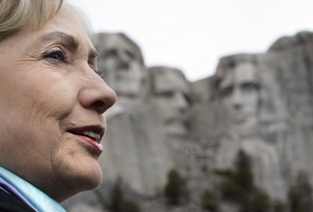 FILE - This photo by Associated Press photographer Elise Amendola shows Democratic presidential hopeful Sen. Hillary Rodham Clinton, D-N.Y., viewing the presidential carvings at Mount Rushmore, near Keystone, S.D., Wednesday, May 28, 2008, as she campaigns in South Dakota. Amendola, who recently retired from the AP, died Thursday, May 11, 2023, at her home in North Andover, Mass., after a 13-year battle with ovarian cancer. She was 70. (AP Photo/Elise Amendola, File)