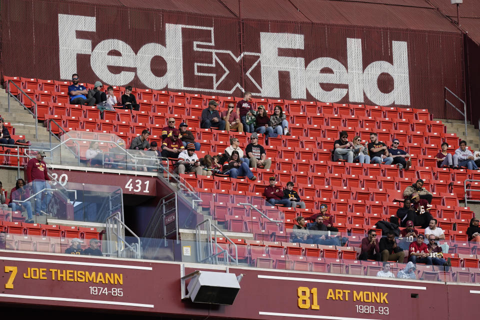 FILE - Fans watch the second half of an NFL football game between the Cleveland Browns and the Washington Commanders, Sunday, Jan. 1, 2023, at FedEx Field in Landover, Md. A group led by Josh Harris and Mitchell Rales that includes Magic Johnson has an agreement in principle to buy the NFL's Washington Commanders from longtime owner Dan Snyder for a North American professional sports team record $6 billion, according to a person with knowledge of the situation. The person spoke to The Associated Press on condition of anonymity Thursday, April 13, 2023, because the deal had not been announced. (AP Photo/Patrick Semansky, File)