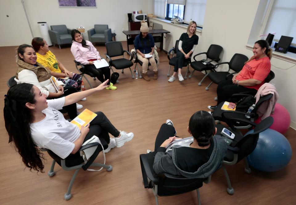 Women who are in their second trimester of pregnancy get to know each other a bit more during Covenant Community Care's Centering Pregnancy program in Detroit on Oct. 11, 2023. Centering Pregnancy offers private prenatal care and group learning on the importance of relaxation during pregnancy, and prenatal yoga exercise routines that can be done at home, among other things.