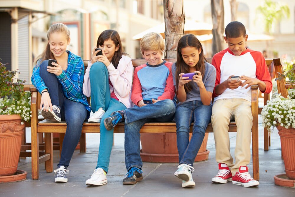 Group of kids texting