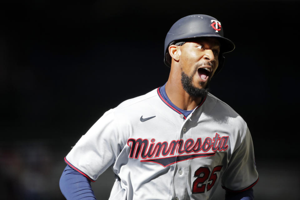 Minnesota Twins' Byron Buxton reacts after hitting a two-run home run during the seventh inning of an opening day baseball game against the Milwaukee Brewers, Thursday, April 1, 2021, in Milwaukee. (AP Photo/Aaron Gash)