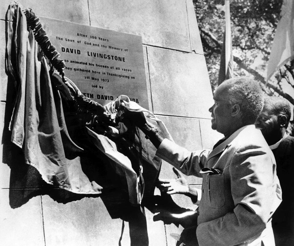 FILE - In this May 3, 1973 file photo, President of Zambia Kenneth Kaunda unveils a plaque commemorating the 100th anniversary of the death in Zambia of missionary explorer David Livingstone during a memorial service in Chupundu, Zambia. Zambia’s first president Kenneth Kaunda has died at the age of 97, the country's president Edward Lungu announced Thursday June 17, 2021. (AP Photo/File)