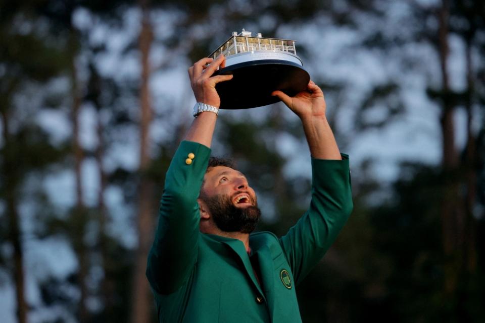 Spain's Jon Rahm celebrates with his green jacket and the trophy after winning The Masters at the Augusta National Golf Club in Georgia April 9, 2023. — Reuters pic