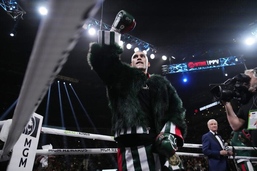 David Benavidez enters the ring before a super middleweight title boxing match against Demetrius Andrade, Saturday, Nov. 25, 2023, in Las Vegas. (AP Photo/John Locher)