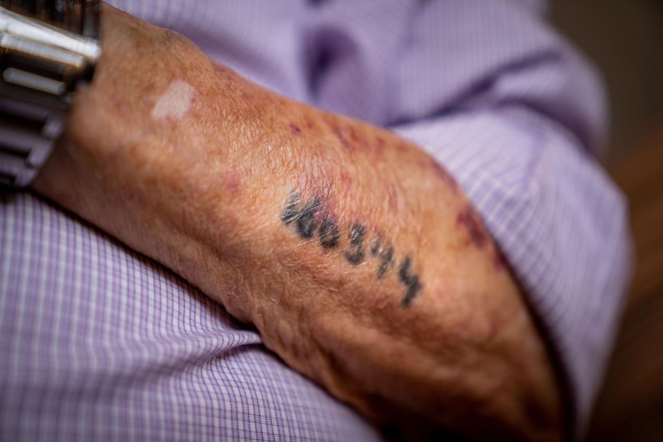 Holocaust survivor David Wolnerman's left forearm still bears the number Nazis tattooed on it at Auschwitz.