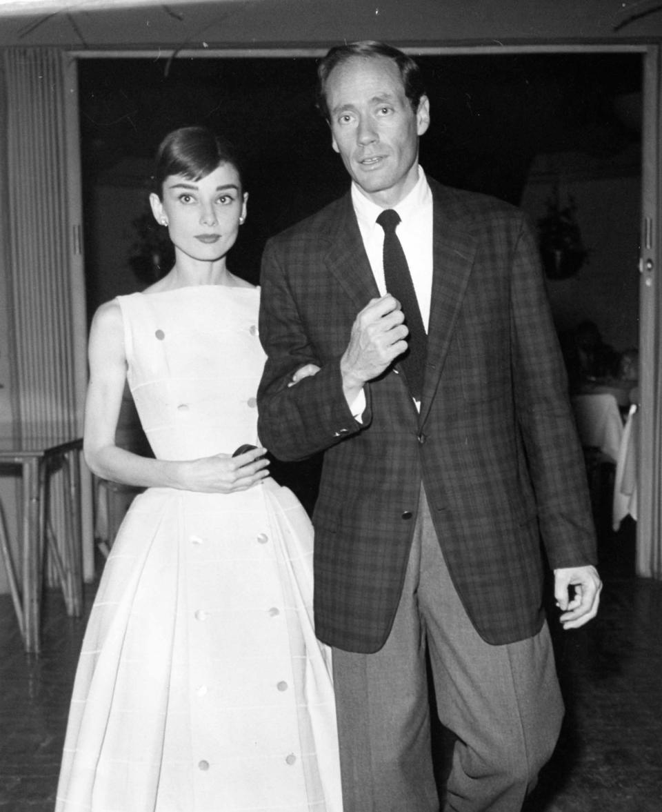 Audrey Hepburn, famously attired by Edith Head, with her husband, Mel Ferrer, at the Racquet Club in Palm Springs c. 1955.